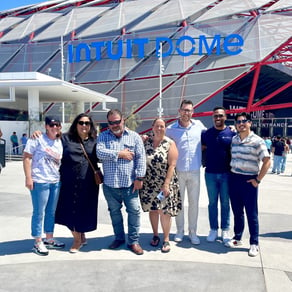 The Collective team members in front of Intuit Dome